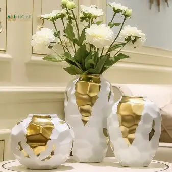 gold and white jars