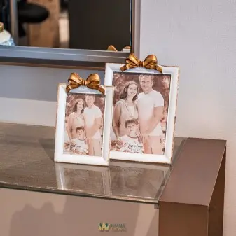 white and gold Photo Frame